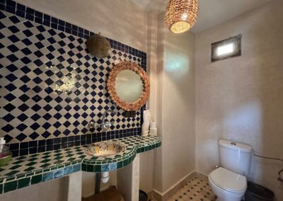 Bathroom with patterned tiles at Dar Essalama