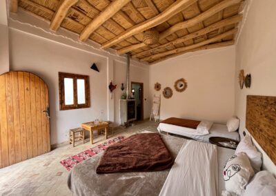 Bedroom with traditional textiles and woven decorations