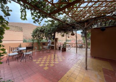 Shaded terrace beneath a pergola at Dar Essalama